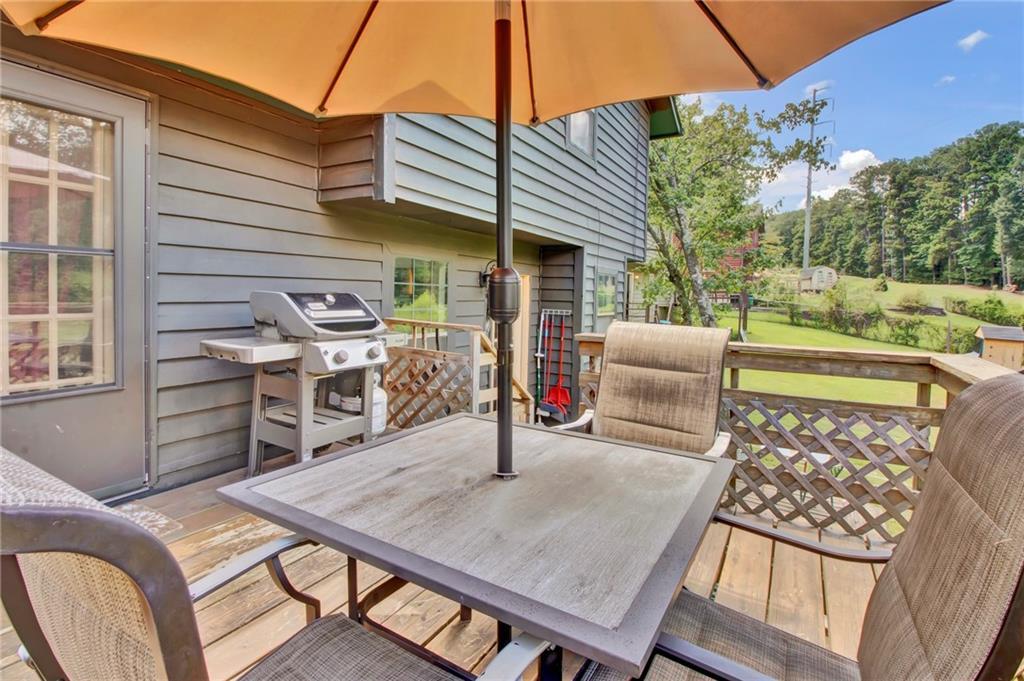 4947 Holbrook Circle Northwest Duluth, GA 30096 - Photo 17 of 26 a view of a patio with table and chairs and potted plants