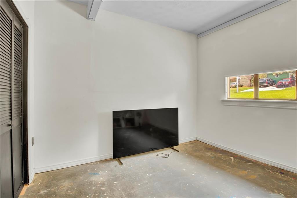 4947 Holbrook Circle Northwest Duluth, GA 30096 - Photo 26 of 26 a bedroom with a bed and a window