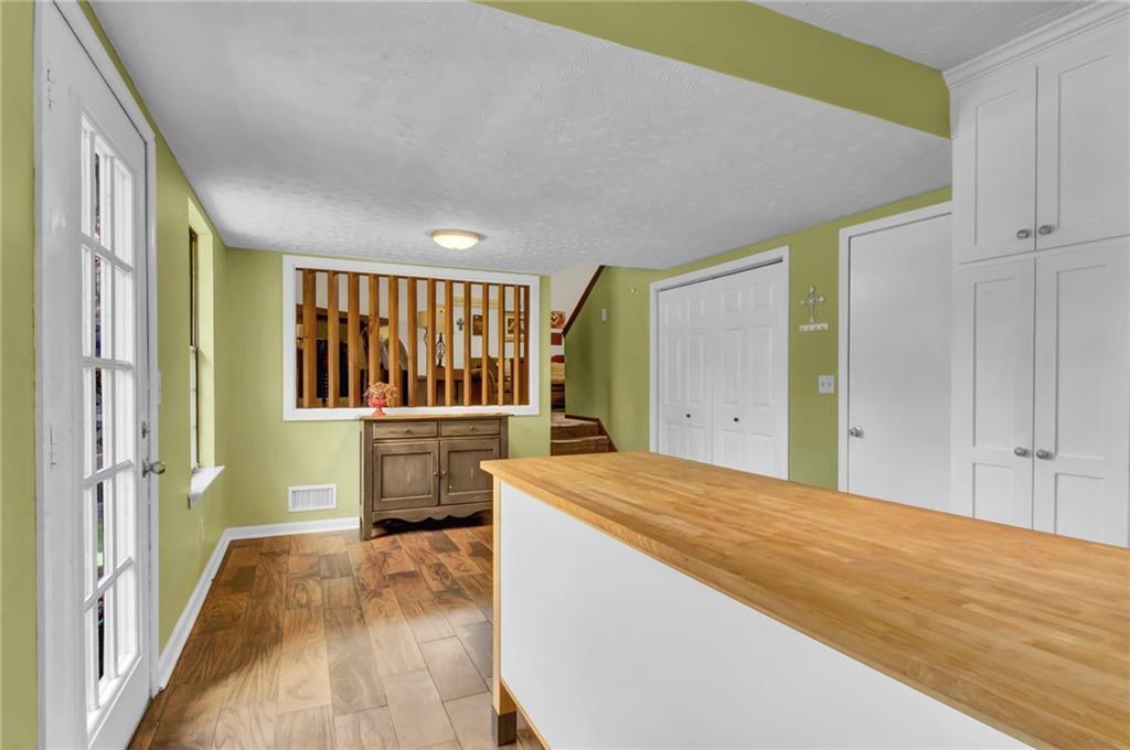 4947 Holbrook Circle Northwest Duluth, GA 30096 - Photo 9 of 26 a bedroom with a bed and a large window