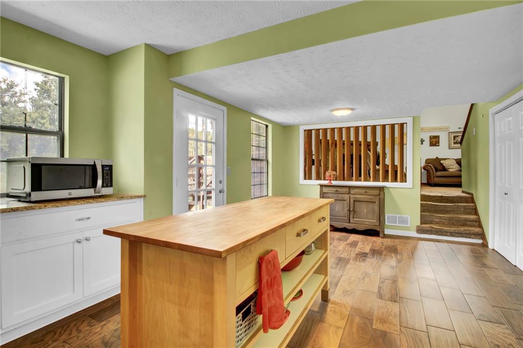 4947 Holbrook Circle Northwest Duluth, GA 30096 - Photo 10 of 26 a kitchen with a sink and a refrigerator