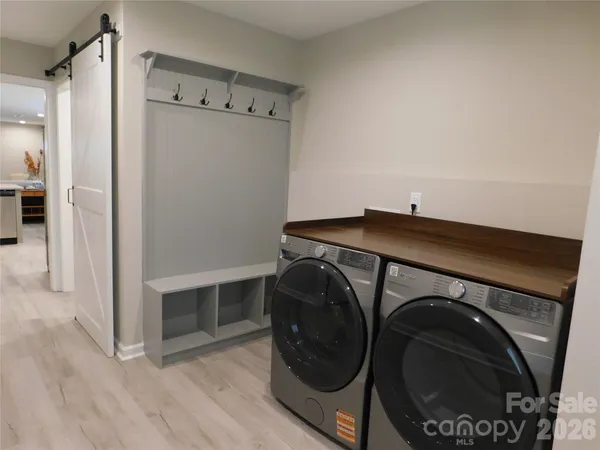 a room with wooden floor and shoes