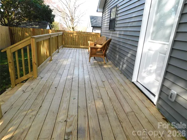 a kitchen with stainless steel appliances granite countertop a refrigerator a stove and a sink
