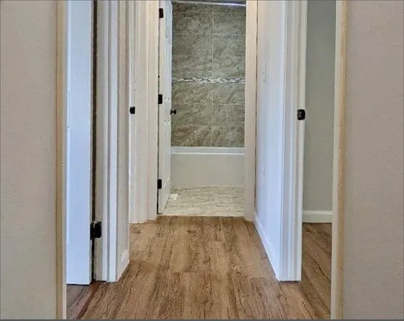 a bathroom with a wooden floor