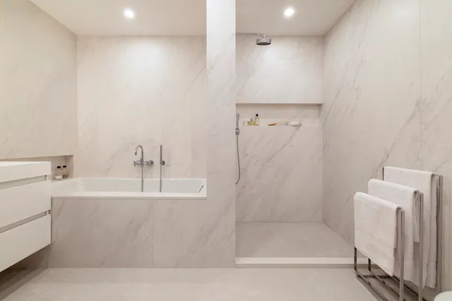 a bathroom with a bathtub and a sink