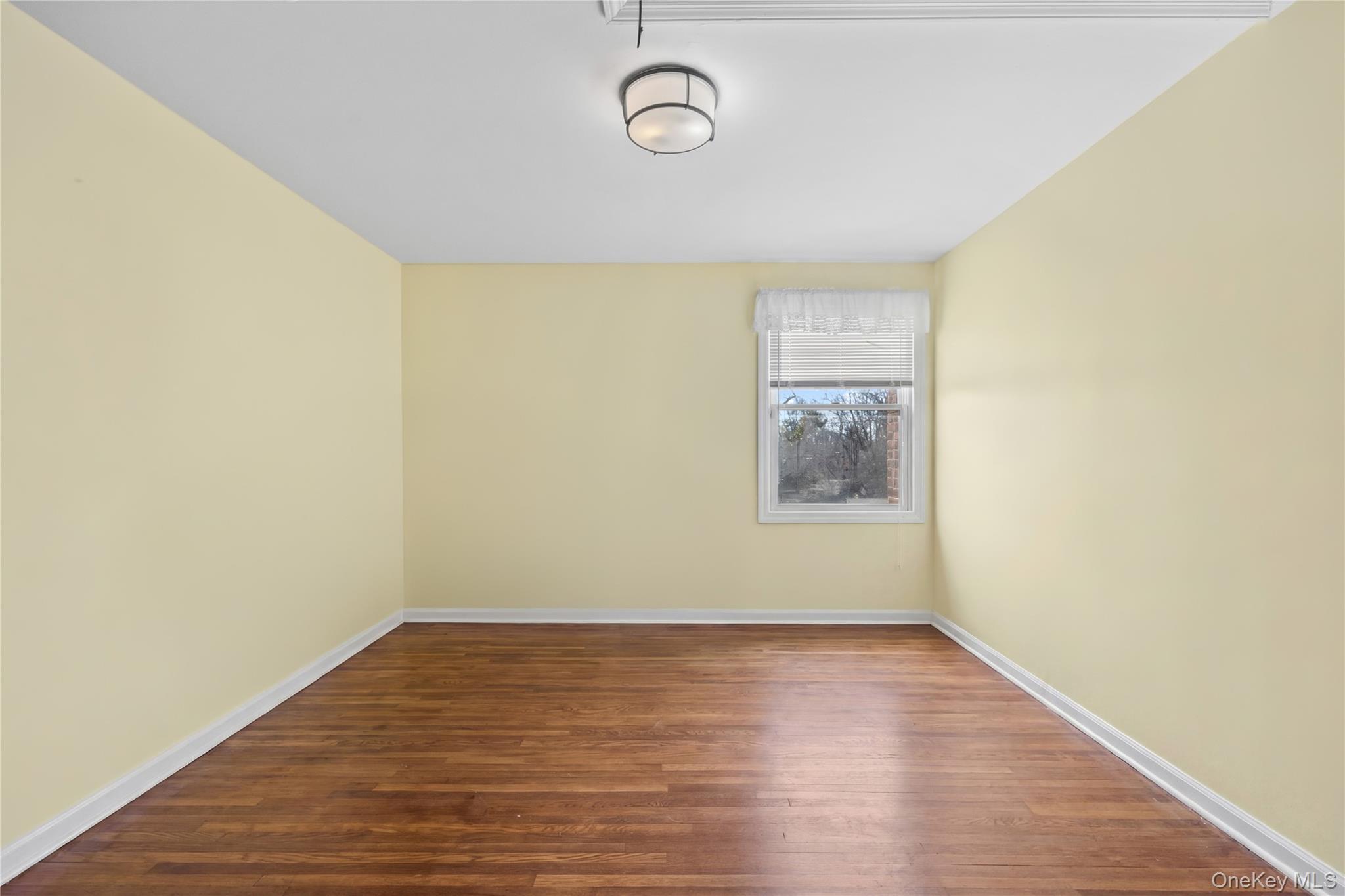 11 Searingtown Road Searingtown, NY 11507 - Photo 18 of 34 a view of room with wooden floor and window