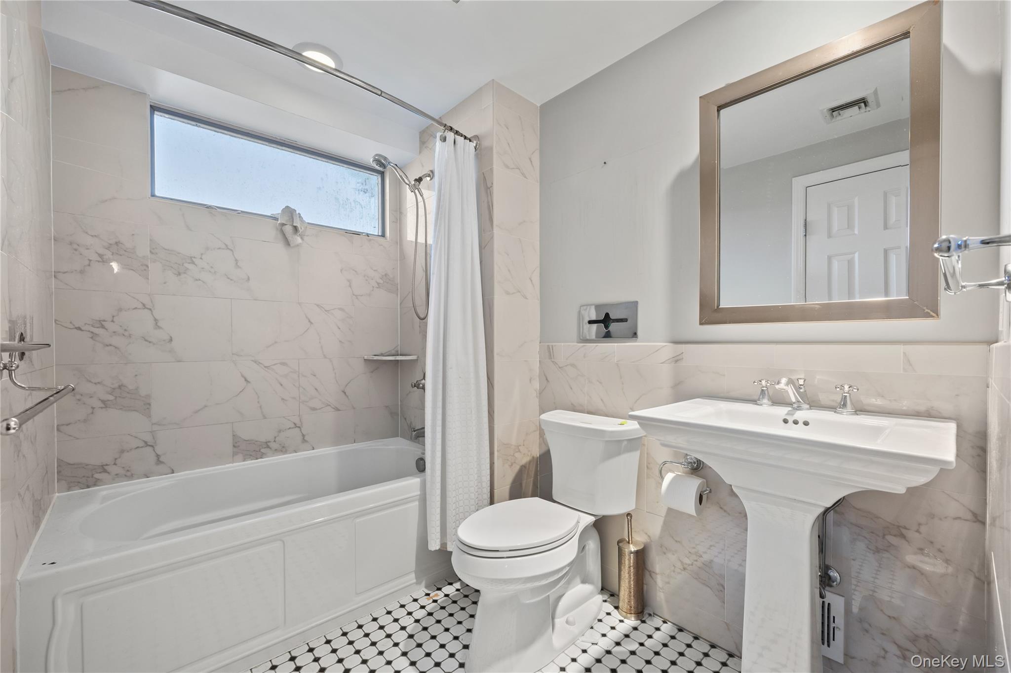 11 Searingtown Road Searingtown, NY 11507 - Photo 23 of 34 a bathroom with a sink toilet and shower