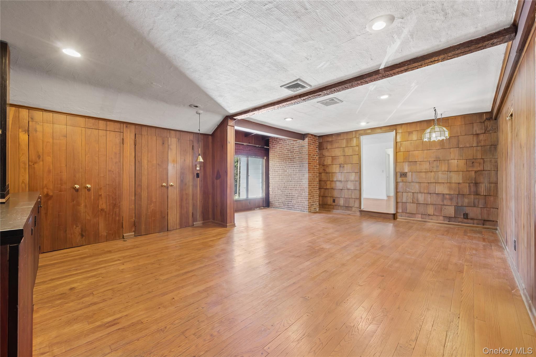 11 Searingtown Road Searingtown, NY 11507 - Photo 6 of 34 a view of an empty room with wooden floor