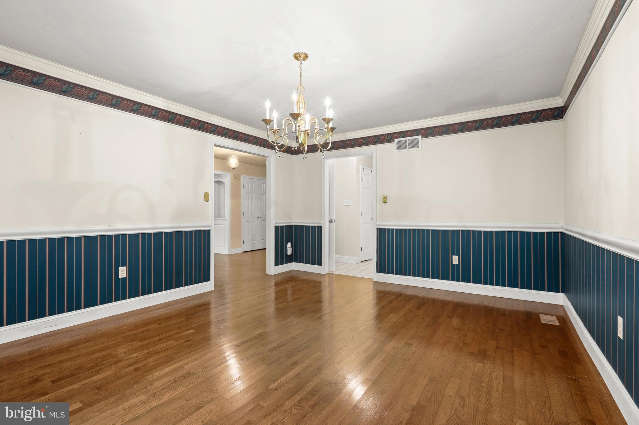 5602 Patterson Road Baldwin, MD 21013 - Photo 36 of 88 Dining Room w/ hardwood, crown molding, chandelier
