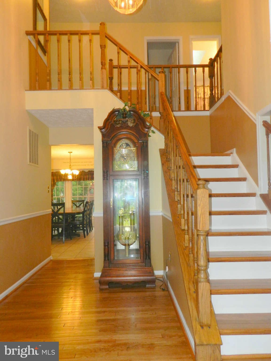 17224 Spates Hill Road Poolesville, MD 20837 - Photo 4 of 30 a view of a balcony with dining room and wooden floor