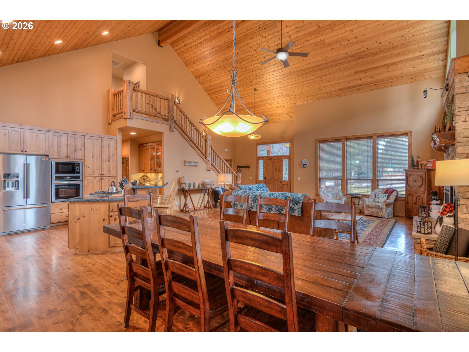 56340 Solar Drive Bend, OR 97707 - Photo 14 of 40 a view of a dining room with furniture and wooden floor