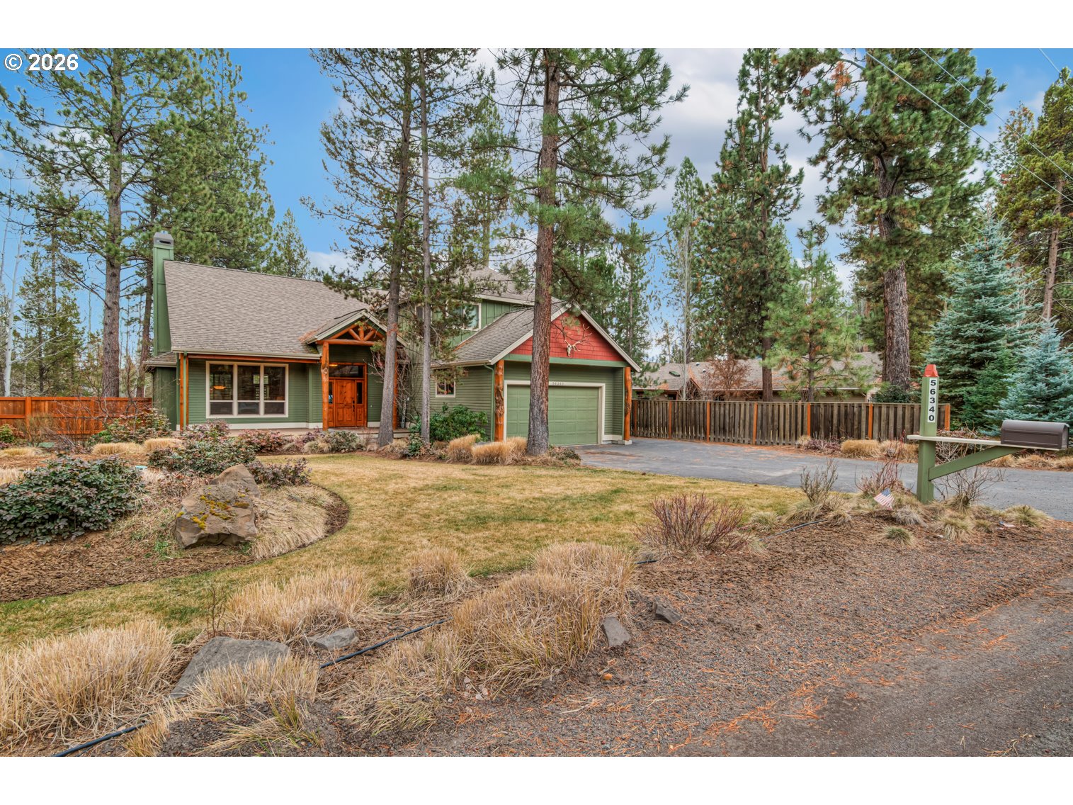 56340 Solar Drive Bend, OR 97707 - Photo 24 of 40 a front view of a house with a yard