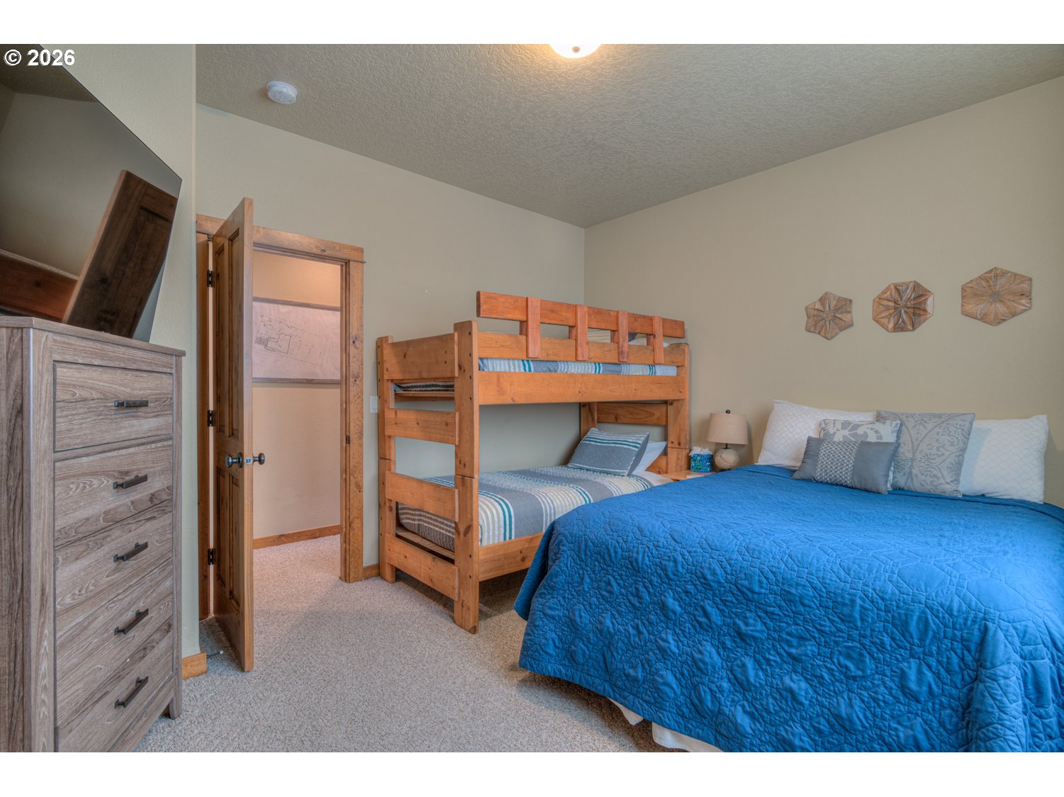 56340 Solar Drive Bend, OR 97707 - Photo 28 of 40 a bedroom with a bed and furniture