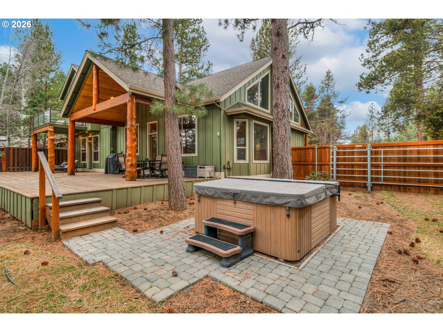 56340 Solar Drive Bend, OR 97707 - Photo 3 of 40 a view of a house with wooden floor and a bench