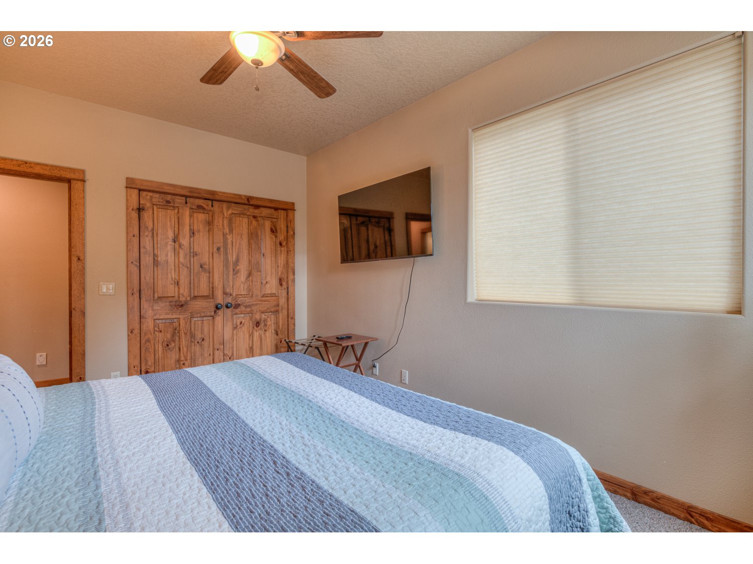 56340 Solar Drive Bend, OR 97707 - Photo 33 of 40 a bedroom with a bed and a window
