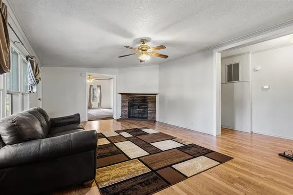 a view of kitchen with furniture and wooden floor