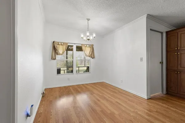 a living room with furniture and a ceiling fan