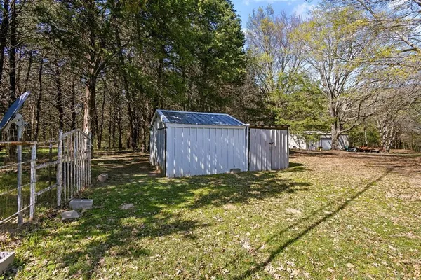 a view of a house with snow on the background