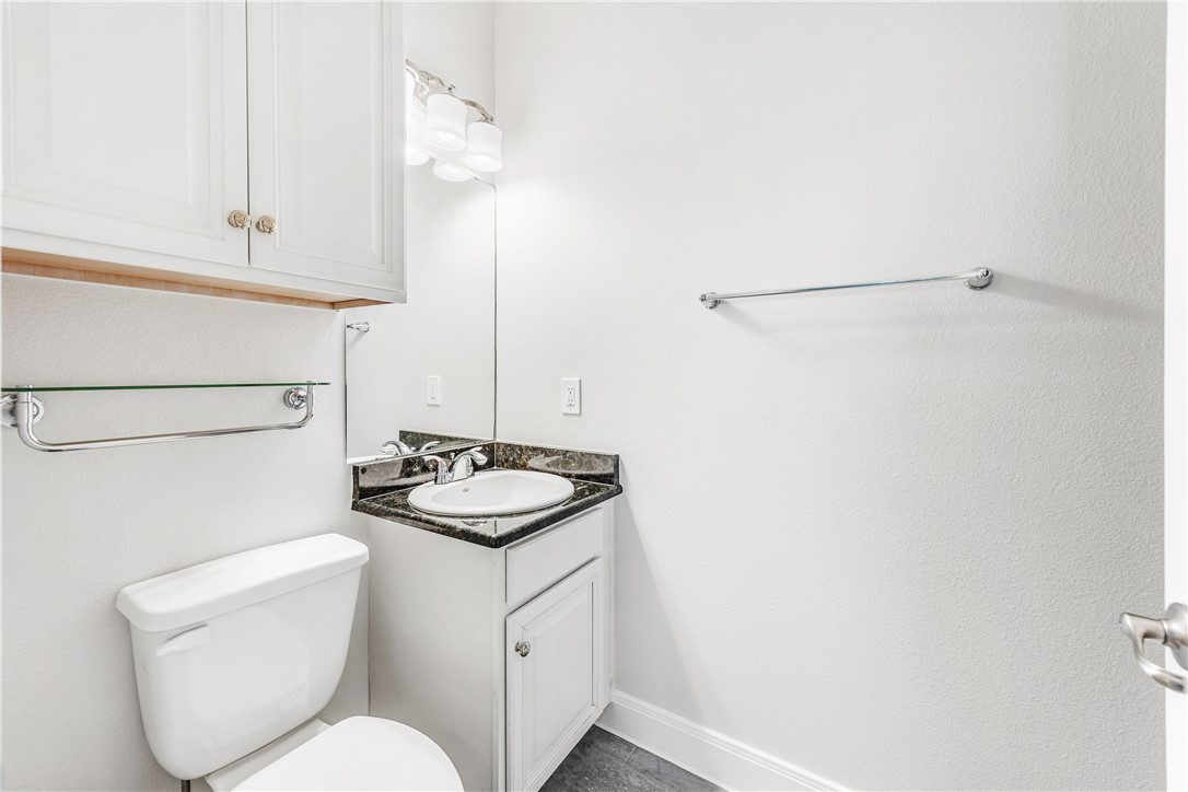 14814 Whitecap Boulevard Corpus Christi, TX 78418 - Photo 18 of 40 a bathroom with a sink and a toilet