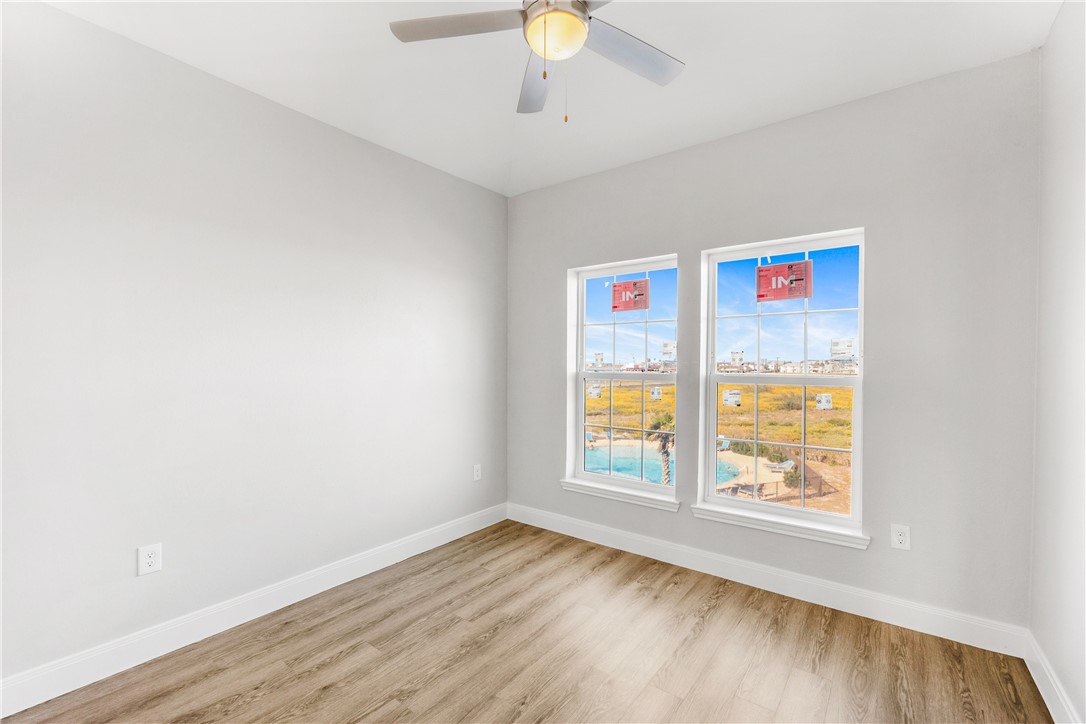 14814 Whitecap Boulevard Corpus Christi, TX 78418 - Photo 22 of 40 an empty room with windows