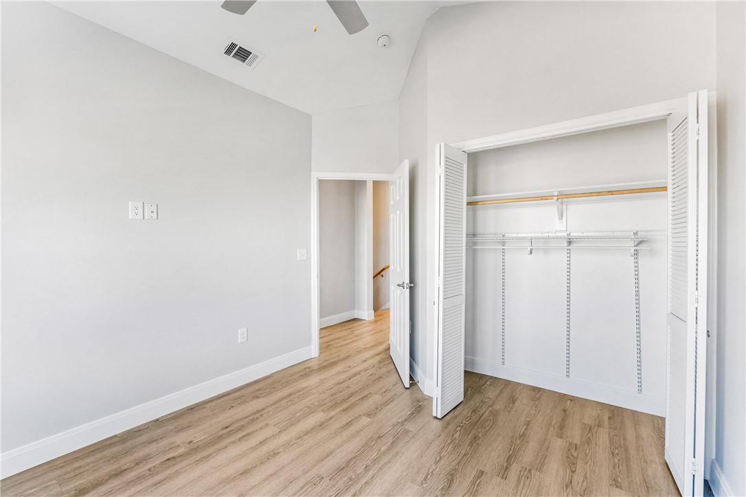 14814 Whitecap Boulevard Corpus Christi, TX 78418 - Photo 23 of 40 an empty room with wooden floor & closet area