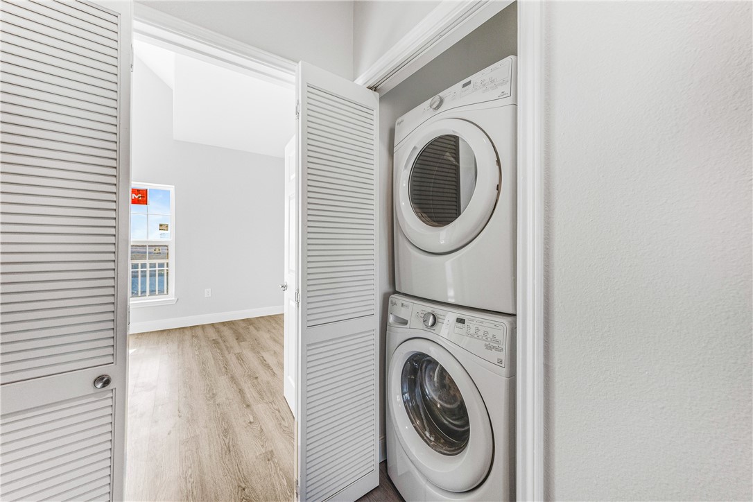 14814 Whitecap Boulevard Corpus Christi, TX 78418 - Photo 26 of 40 a view of a hallway with washer and dryer