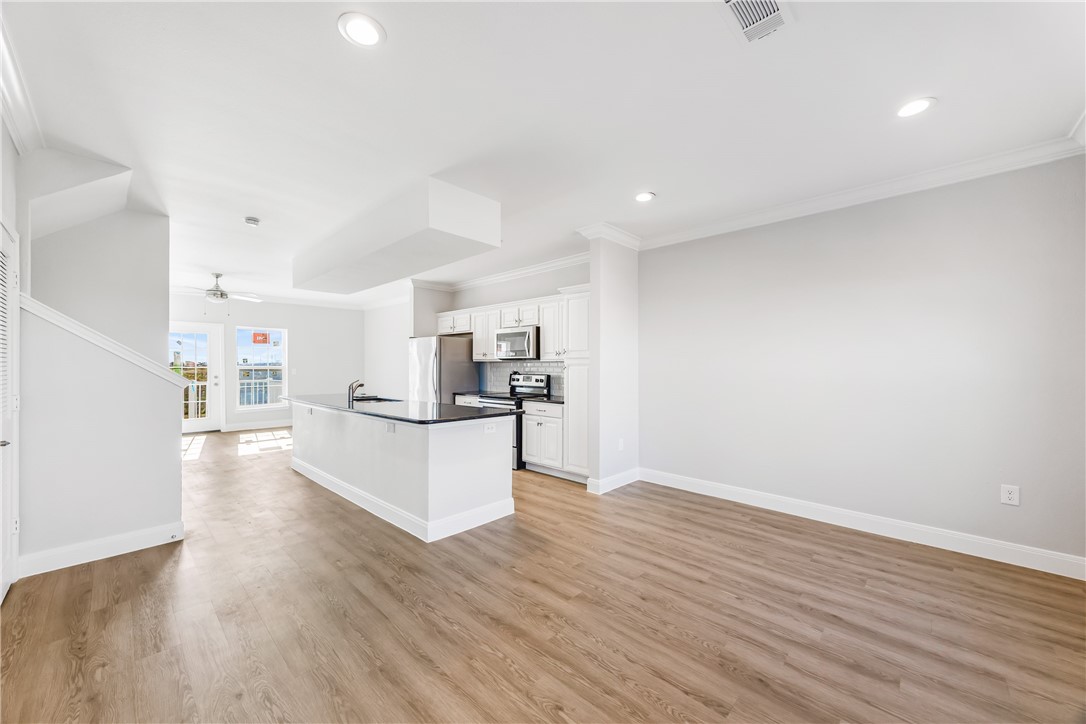 14814 Whitecap Boulevard Corpus Christi, TX 78418 - Photo 9 of 40 a view of kitchen with wooden floor and electronic appliances