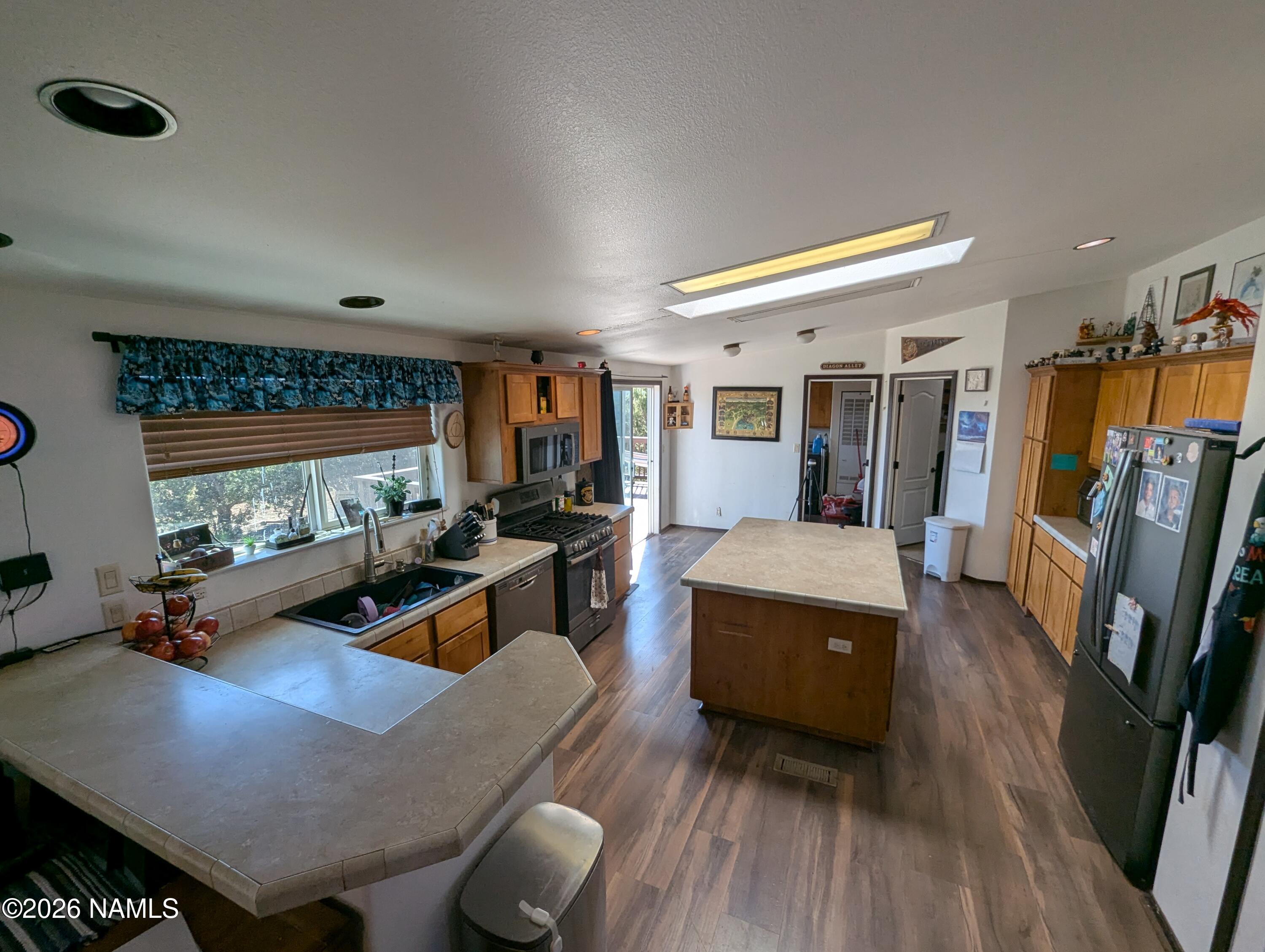 2186 East Clear Point Way Williams, AZ 86046 - Photo 11 of 43 a living room with furniture and a flat screen tv