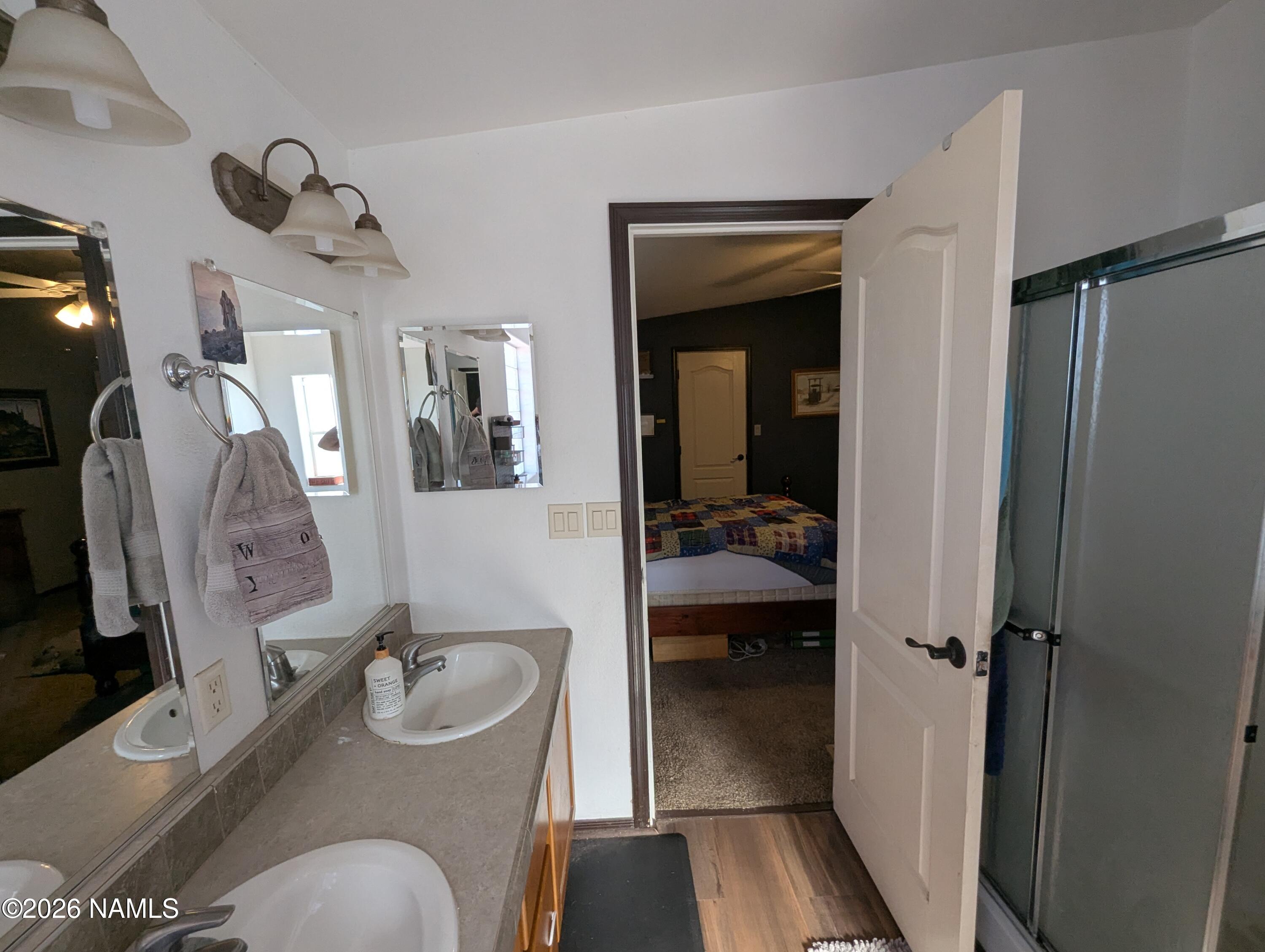 2186 East Clear Point Way Williams, AZ 86046 - Photo 16 of 43 a en suite bathroom with a granite countertop toilet sink and mirror