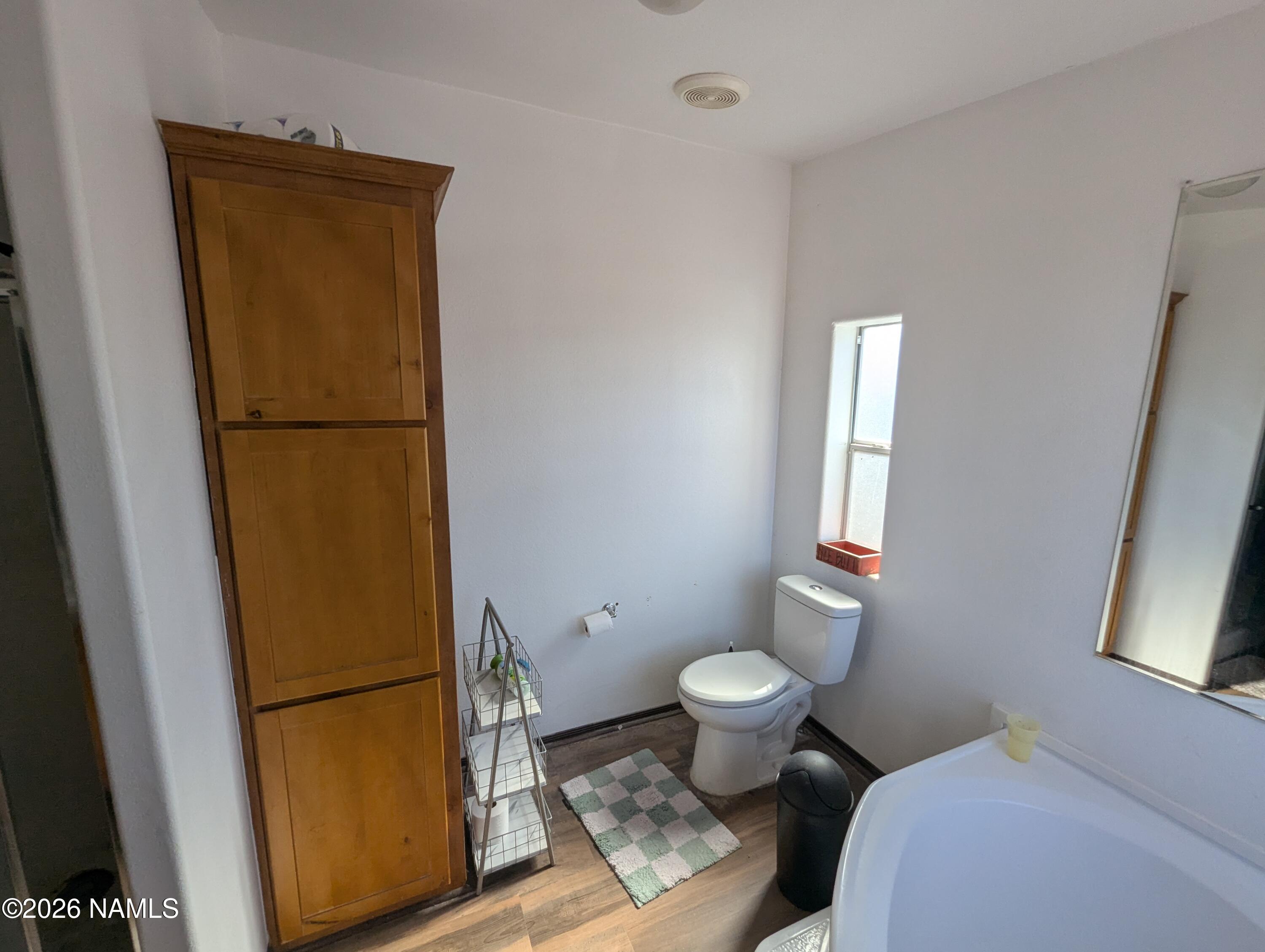 2186 East Clear Point Way Williams, AZ 86046 - Photo 18 of 43 a bathroom with a toilet and a shower