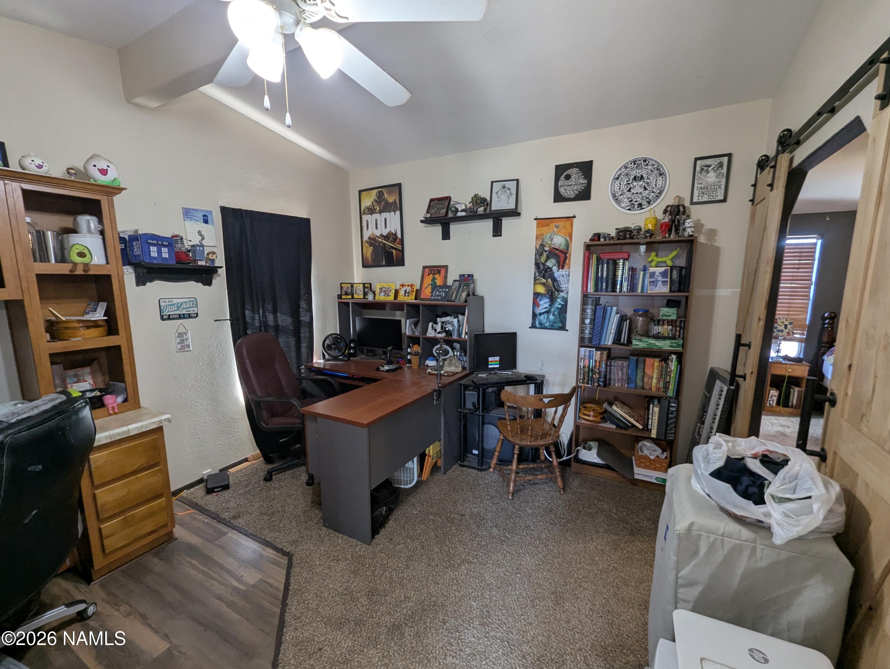 2186 East Clear Point Way Williams, AZ 86046 - Photo 19 of 43 a view of a livingroom with workspace and a window