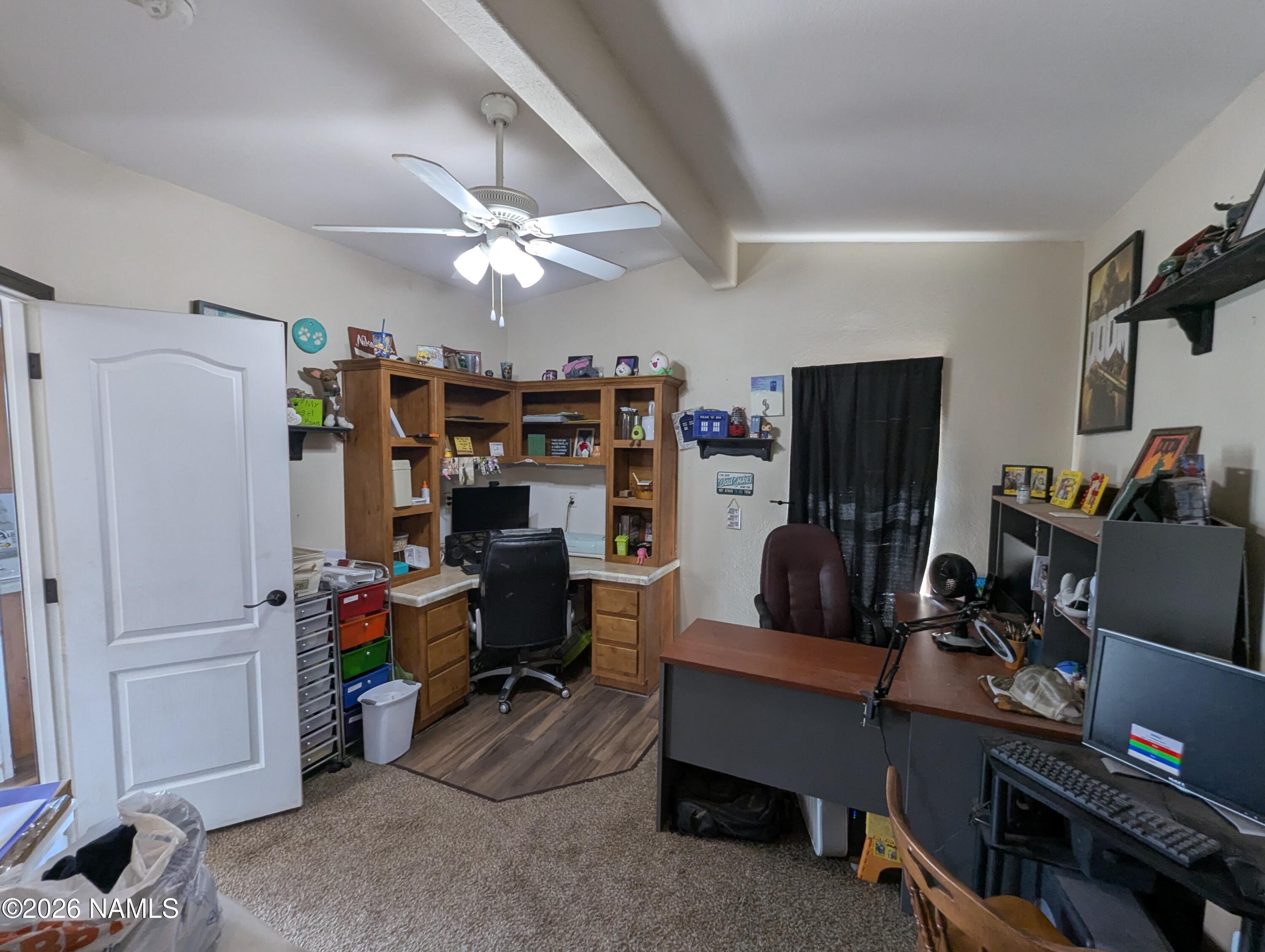 2186 East Clear Point Way Williams, AZ 86046 - Photo 20 of 43 a view of a workspace with furniture and a window