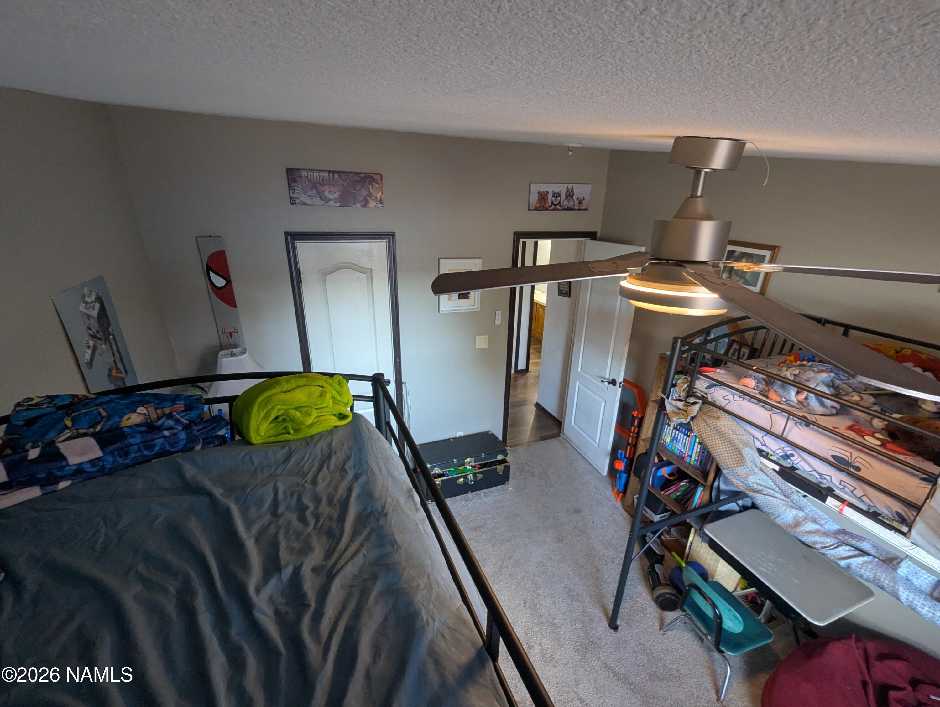 2186 East Clear Point Way Williams, AZ 86046 - Photo 22 of 43 a bed room with furniture and wooden floor