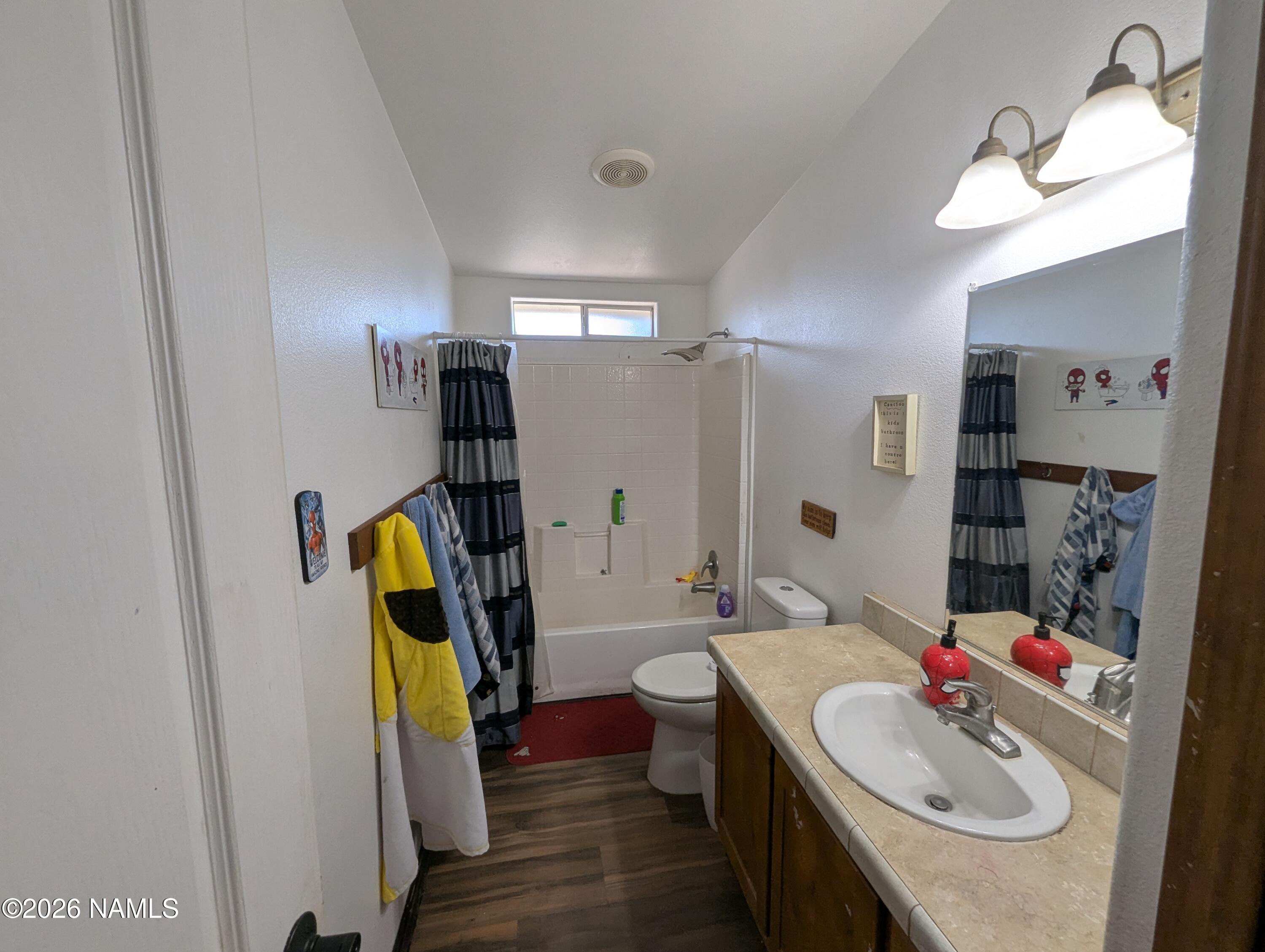 2186 East Clear Point Way Williams, AZ 86046 - Photo 25 of 43 a bathroom with a sink and a mirror