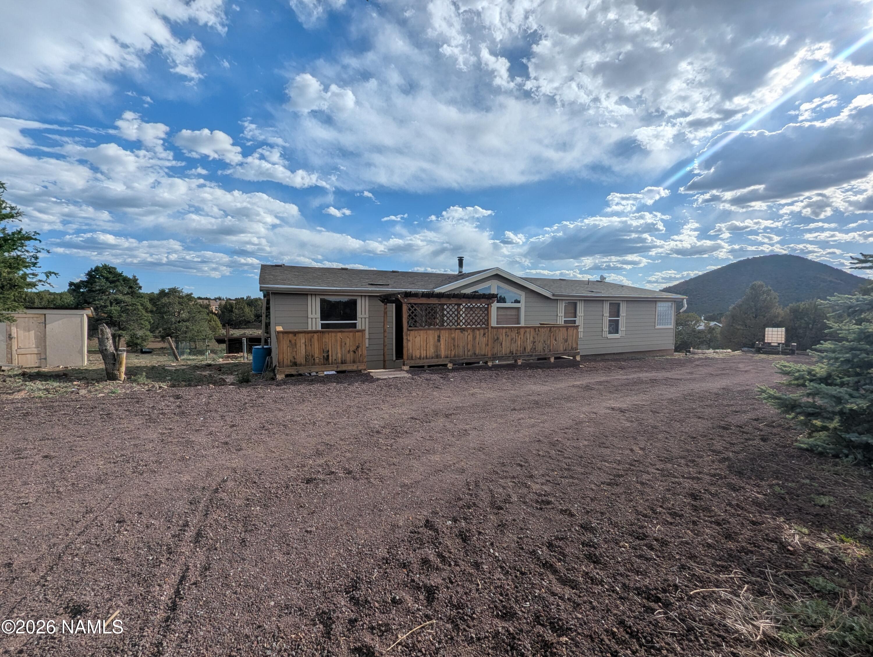 2186 East Clear Point Way Williams, AZ 86046 - Photo 28 of 43 a view of house with yard and entertaining space