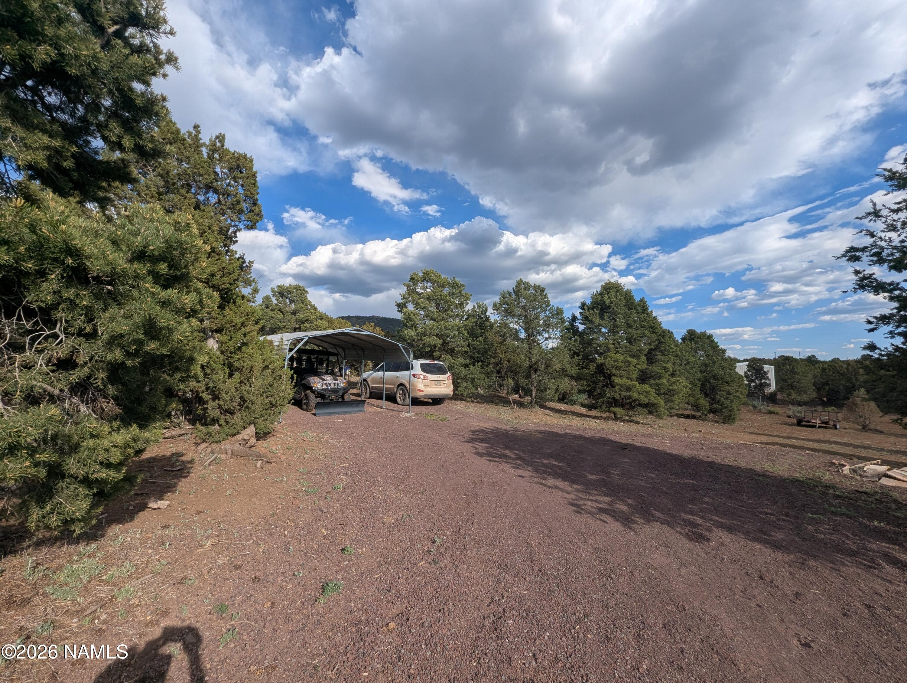 2186 East Clear Point Way Williams, AZ 86046 - Photo 29 of 43 a view of a road with trees