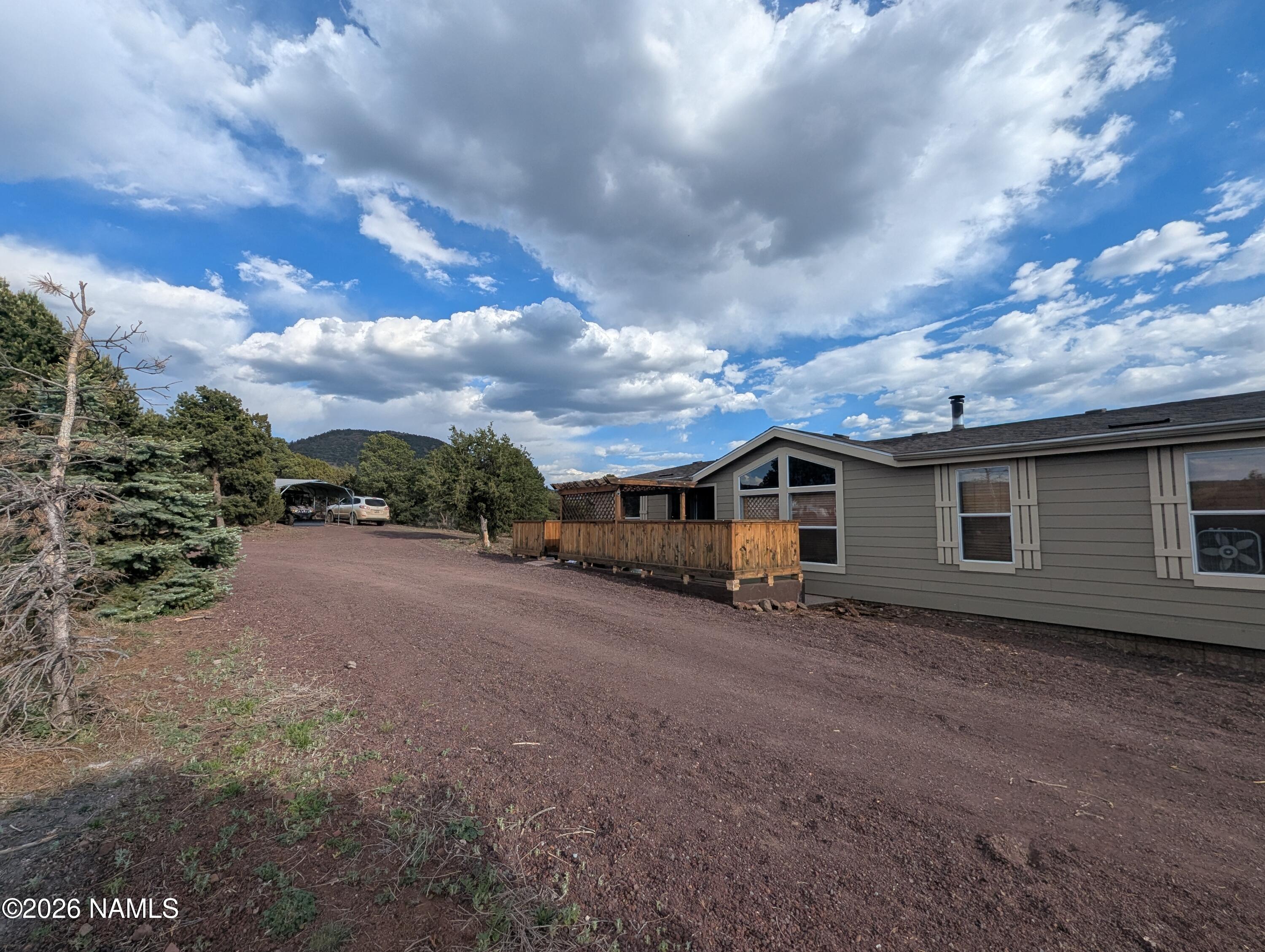 2186 East Clear Point Way Williams, AZ 86046 - Photo 30 of 43 a view of a house with a backyard