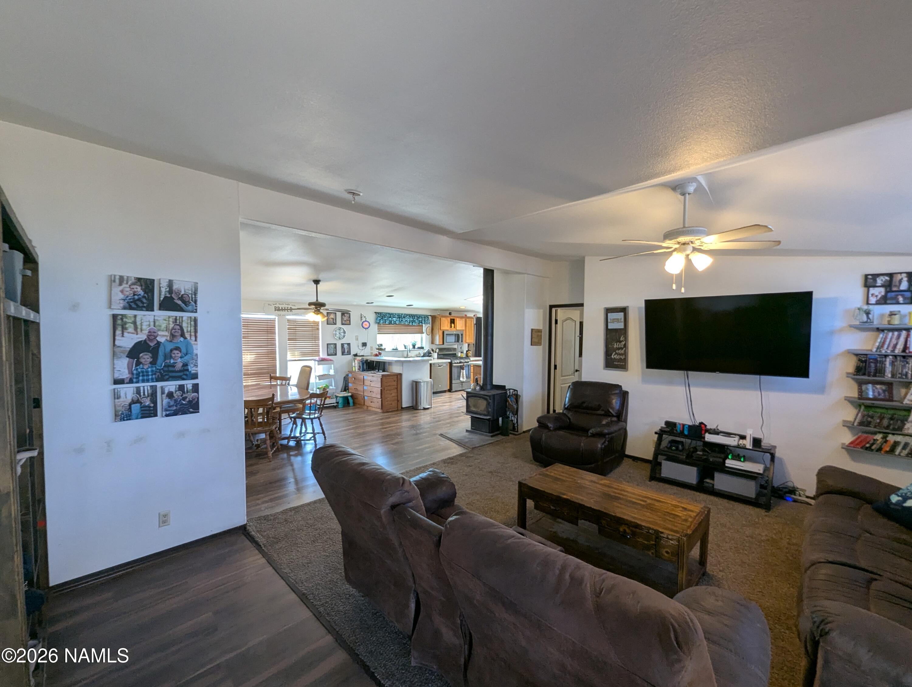 2186 East Clear Point Way Williams, AZ 86046 - Photo 3 of 43 a living room with furniture and a flat screen tv