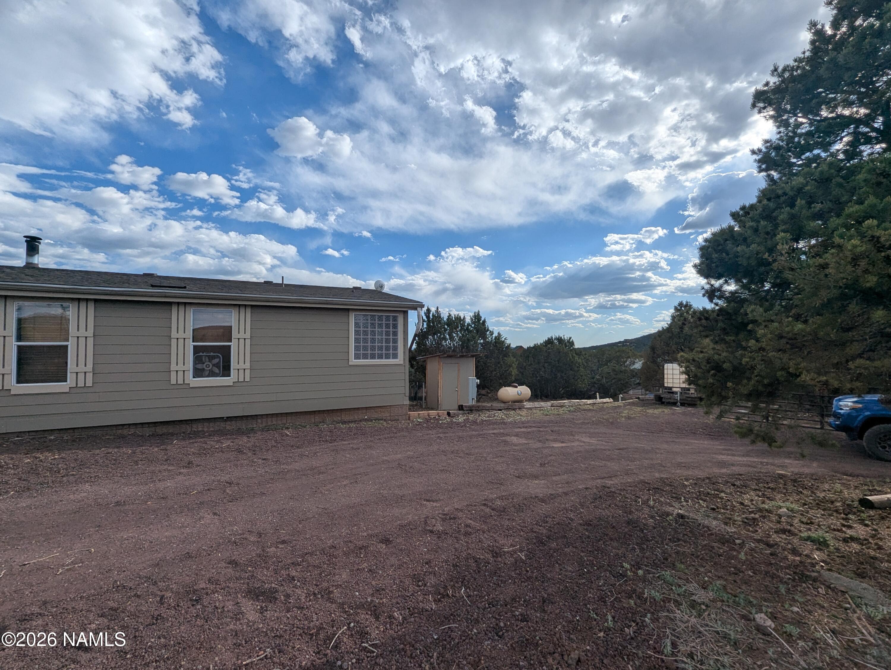 2186 East Clear Point Way Williams, AZ 86046 - Photo 31 of 43 a view of a house with a yard