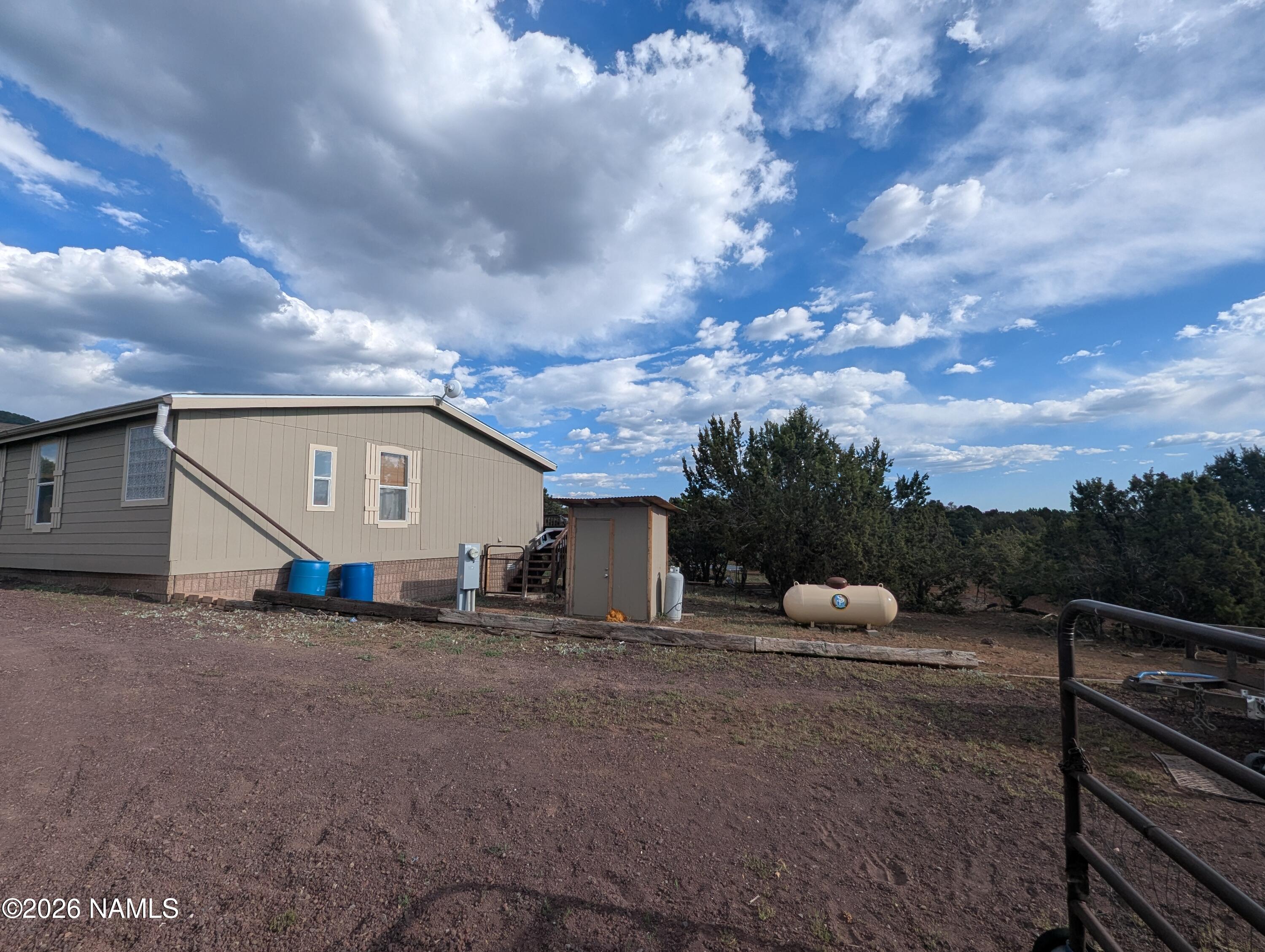 2186 East Clear Point Way Williams, AZ 86046 - Photo 33 of 43 a view of a house with a yard