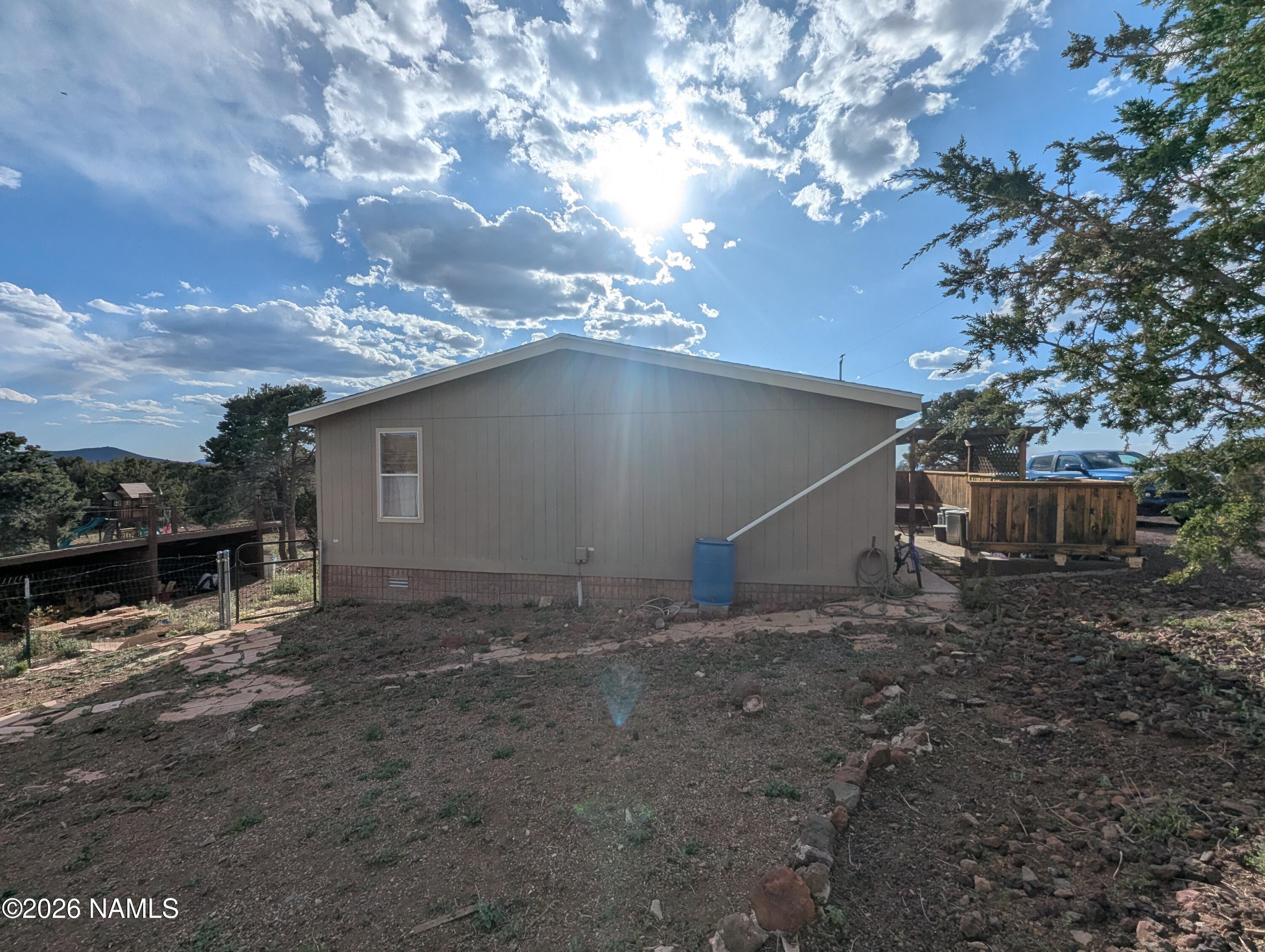 2186 East Clear Point Way Williams, AZ 86046 - Photo 34 of 43 a view of a house with a yard
