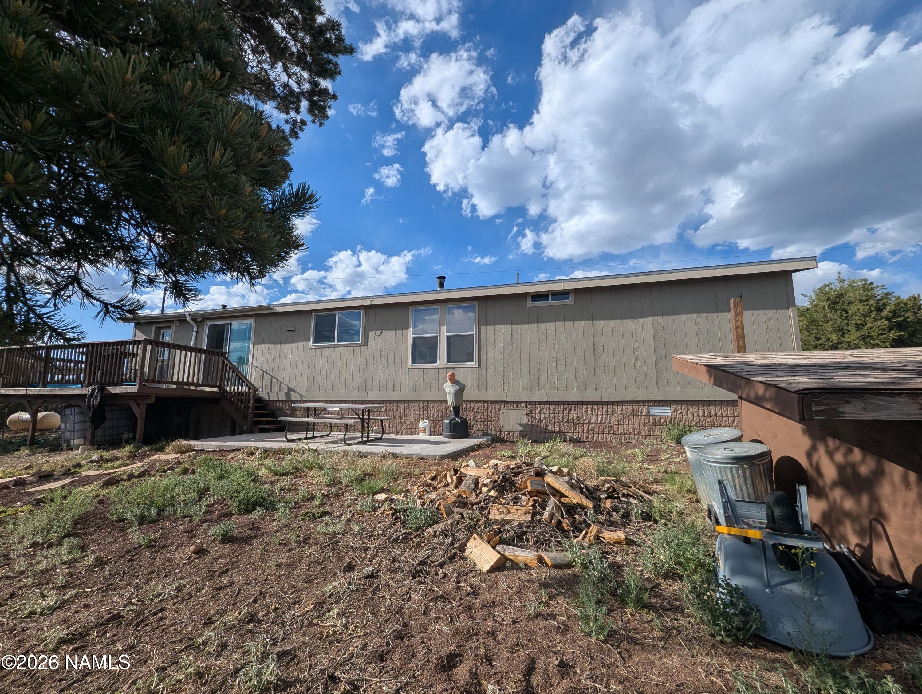 2186 East Clear Point Way Williams, AZ 86046 - Photo 36 of 43 a backyard of a house with table and chairs
