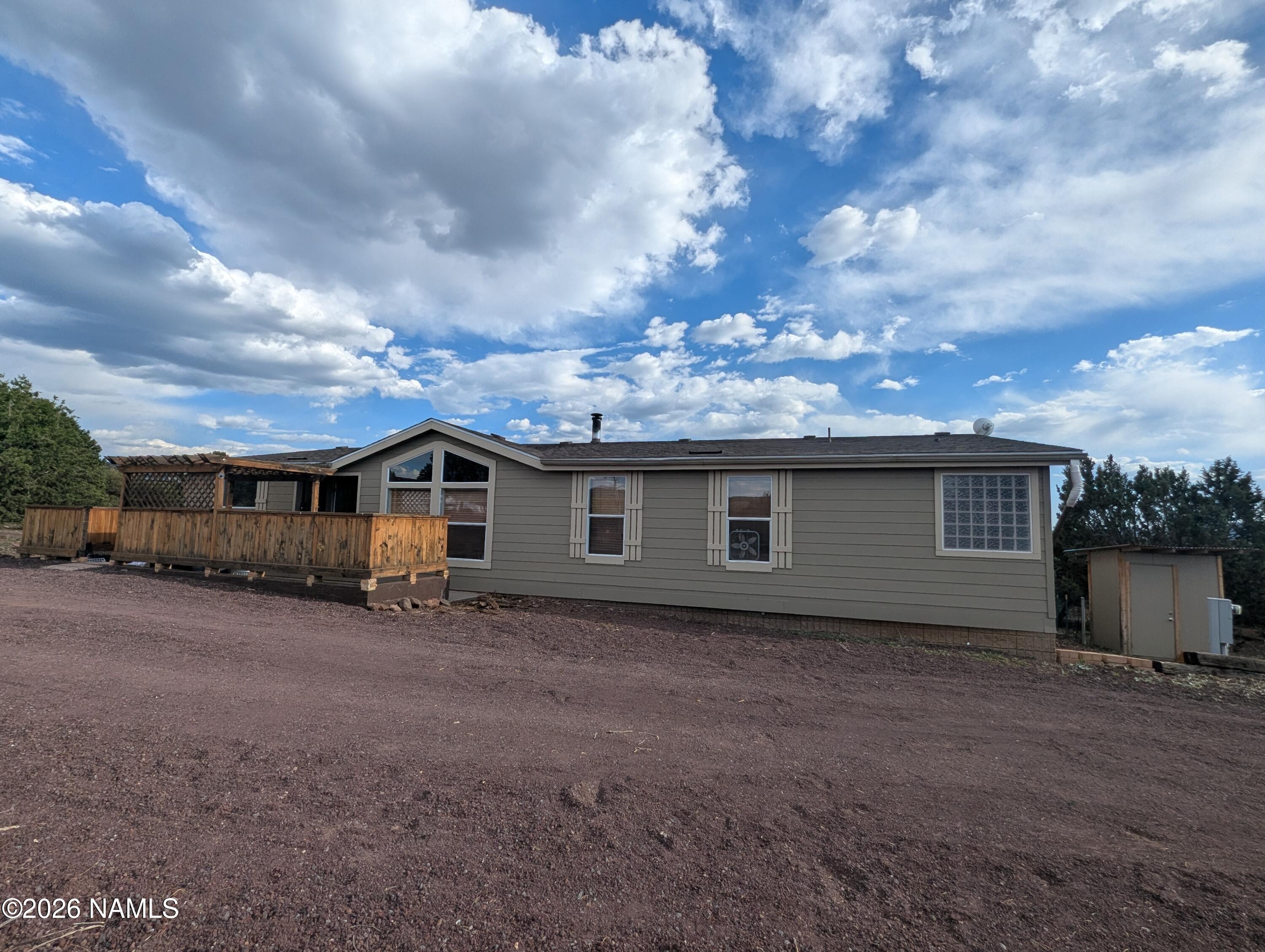 2186 East Clear Point Way Williams, AZ 86046 - Photo 40 of 43 a view of a house with a backyard