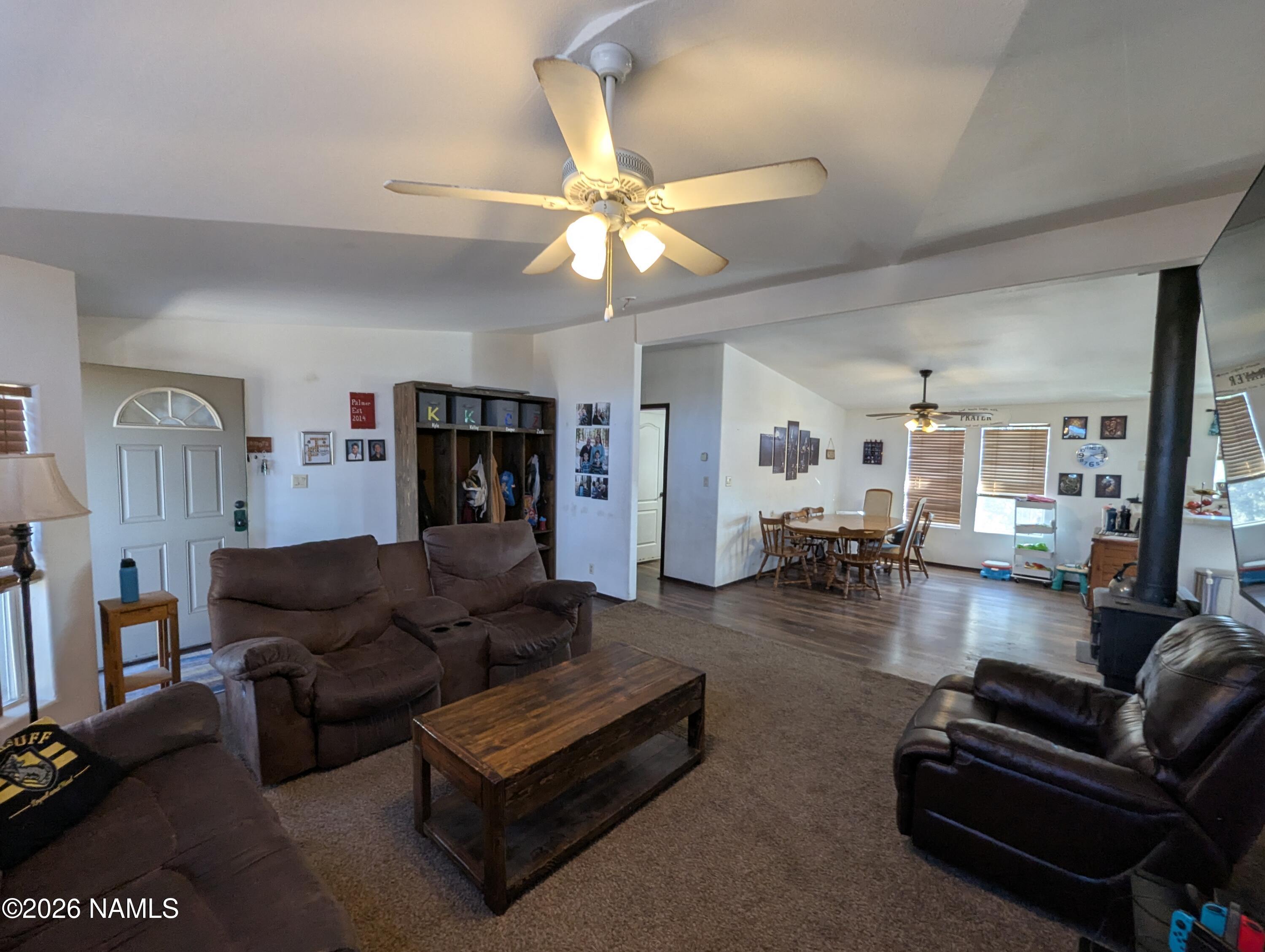 2186 East Clear Point Way Williams, AZ 86046 - Photo 4 of 43 a living room with furniture and a chandelier