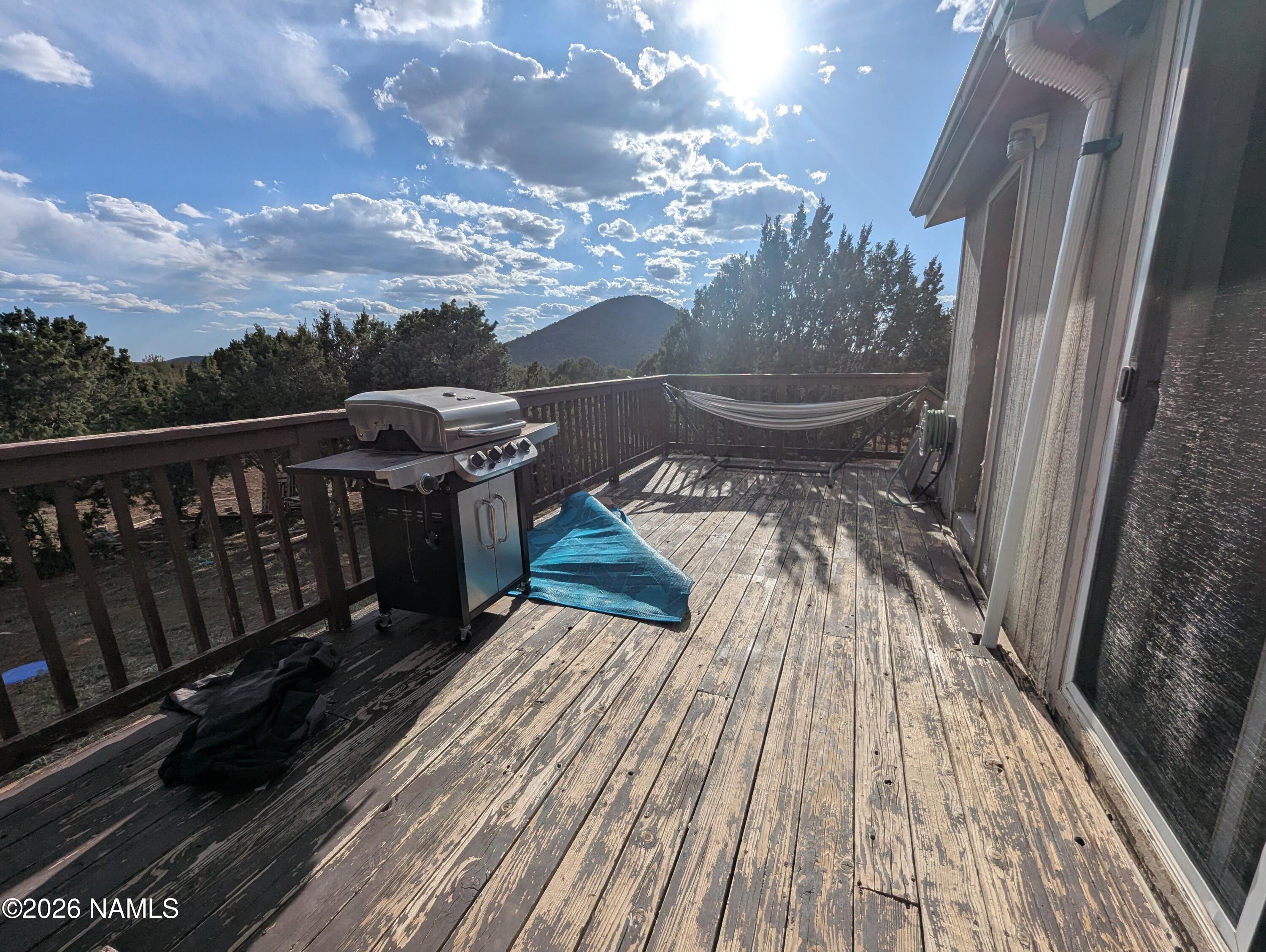 2186 East Clear Point Way Williams, AZ 86046 - Photo 42 of 43 a view of a balcony with wooden floor and city view