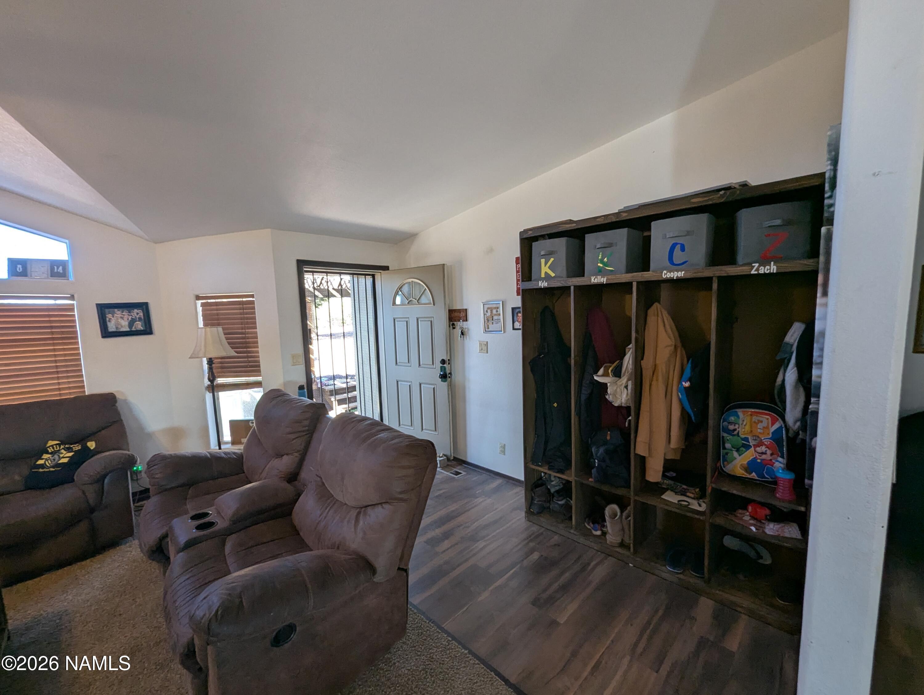 2186 East Clear Point Way Williams, AZ 86046 - Photo 6 of 43 a living room with furniture a ceiling fan and a window