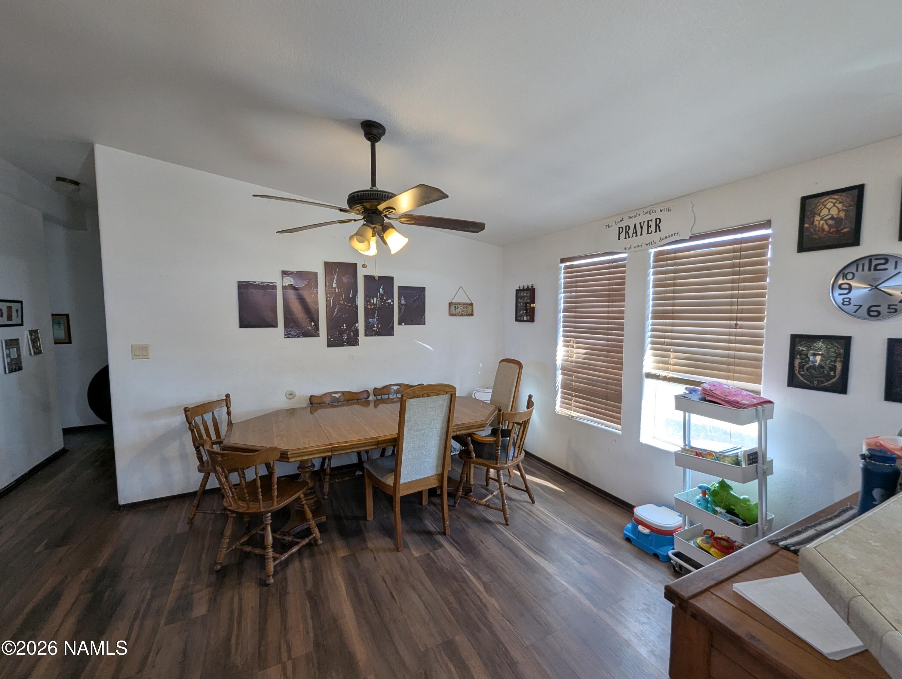 2186 East Clear Point Way Williams, AZ 86046 - Photo 9 of 43 a dining room with furniture a window and wooden floor
