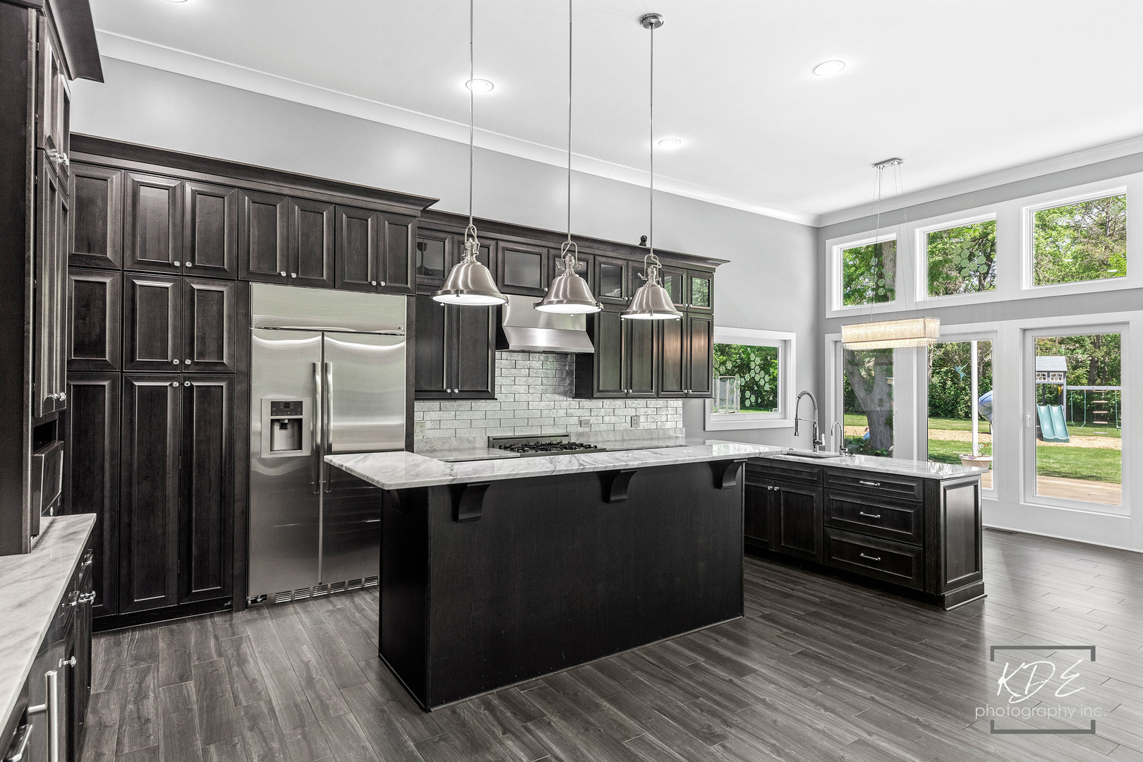 27W320 80th Street Naperville, IL 60565 - Photo 13 of 37 a kitchen with stainless steel appliances granite countertop a sink and wooden floor