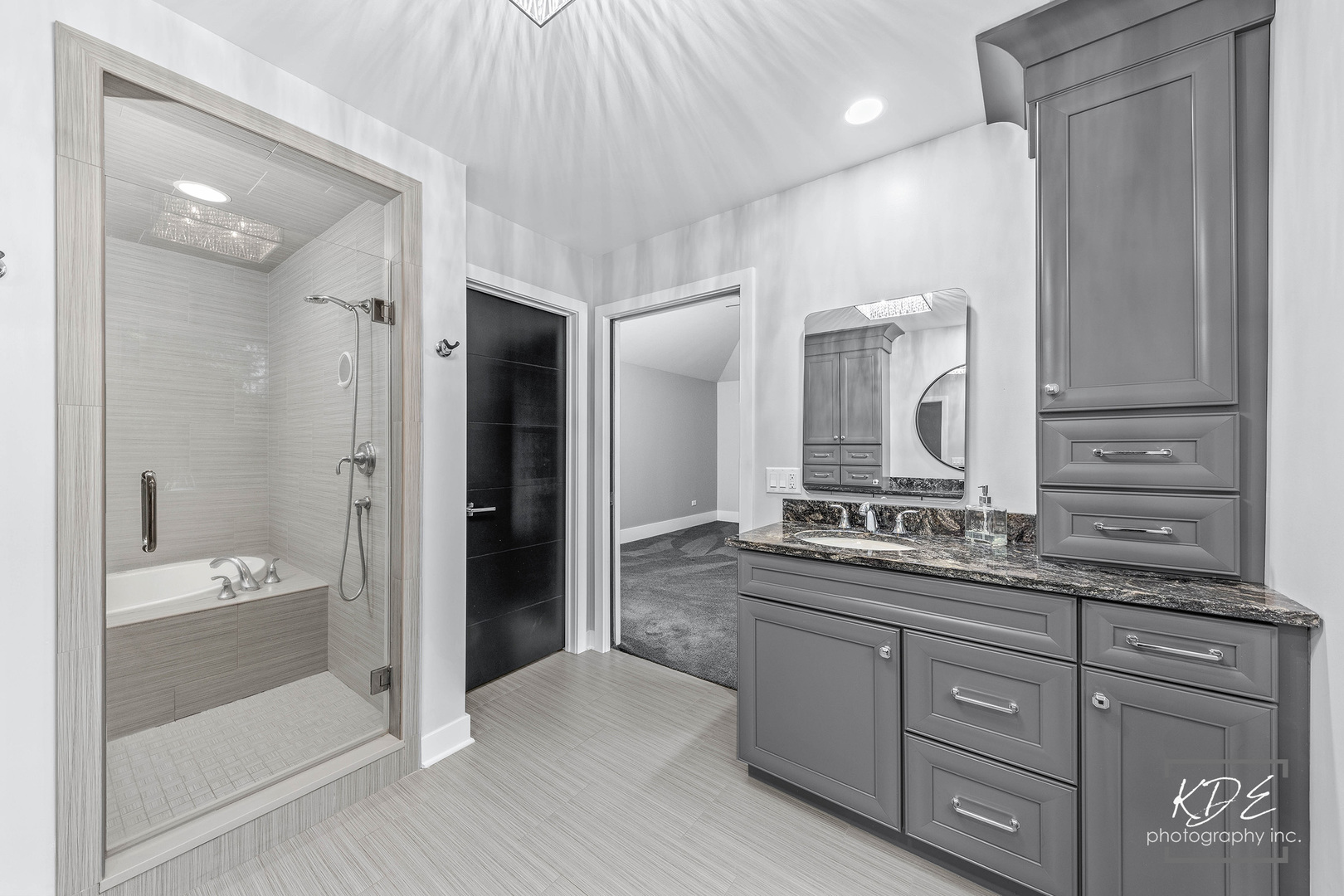 27W320 80th Street Naperville, IL 60565 - Photo 19 of 37 a spacious bathroom with a granite countertop sink mirror and shower