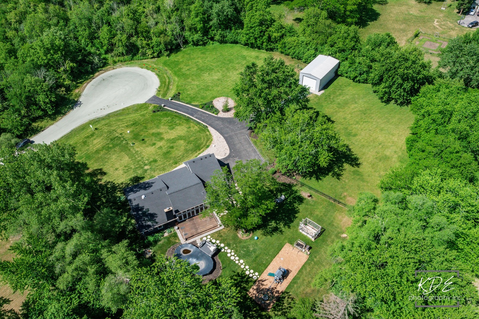 27W320 80th Street Naperville, IL 60565 - Photo 30 of 37 an aerial view of a house with a yard and trees all around
