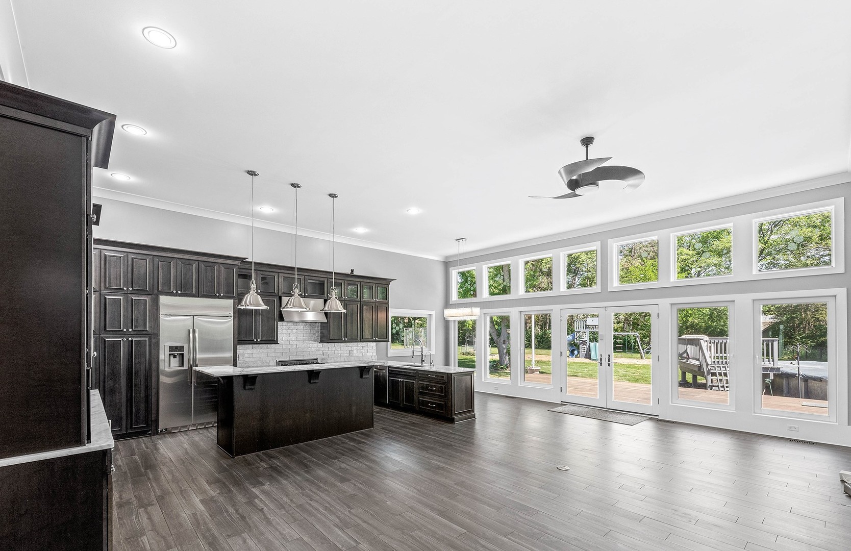 27W320 80th Street Naperville, IL 60565 - Photo 7 of 37 a view of a kitchen with a sink and wooden floor